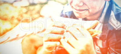 Boy having sandwich in picnic at park