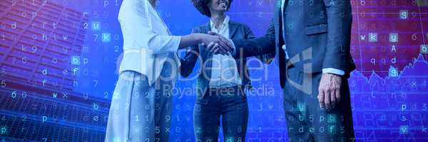Composite image of business people giving handshake while standing against white background