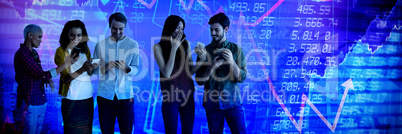 Composite image of happy co-workers team using smartphones
