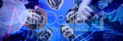 Composite image of low angle portrait of happy business people pointing