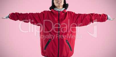 Composite image of smiling woman standing with arms outstretched