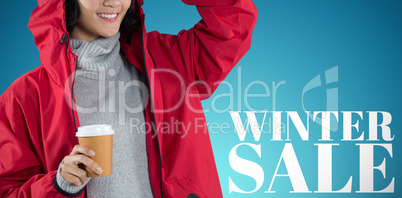 Composite image of woman in red jacket having coffee against white background