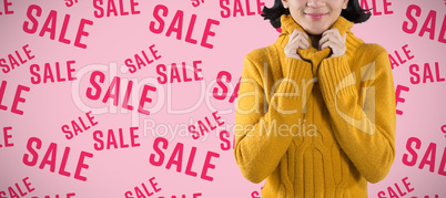 Composite image of woman in winter clothing posing against white background