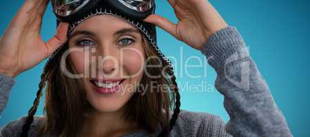 Composite image of portrait of woman with ski goggles