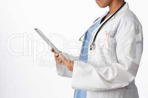 female doctor wearing breast cancer awareness pink ribbon holding a tablet