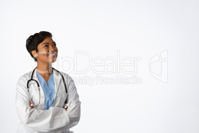Smiling hopeful female doctor with crossed arms