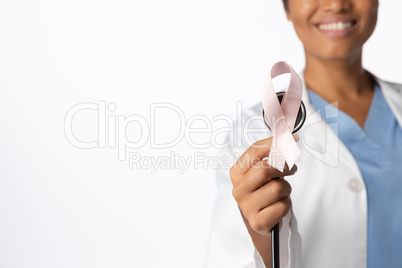breast cancer awareness pink ribbon on a stethoscope