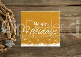 Happy holidays text with wood decoration