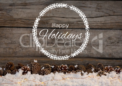 Happy holidays text with wood and pine cones in snow