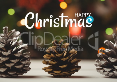 Happy Christmas text with decoration pine cones