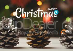Happy Christmas text with decoration pine cones