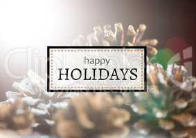 Happy holidays text with pine cones