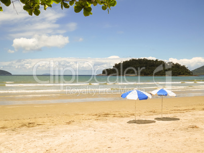 View of sun day on the beach with sunshade.