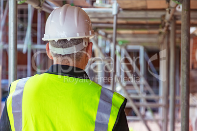 Rear View of a Construction Worker on Building Site