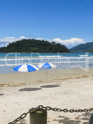 Beach in sunny day, with blue sky.