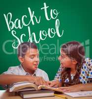 Back To School Written On Chalk Board Behind Hispanic Boy and Girl