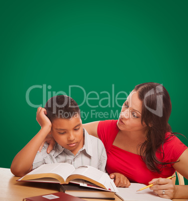 Blank Chalk Board Behind Hispanic Young Boy and Female Adult