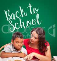 Back To School Written On Chalk Board Behind Hispanic Young Boy and Tutor