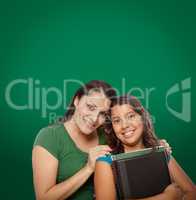 Blank Chalk Board Behind Proud Hispanic Mother and Daughter Student