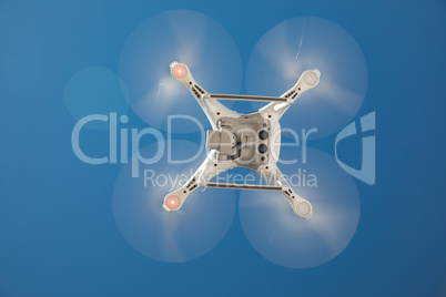 Drone Quadcopter From Below Against A Blue Sky