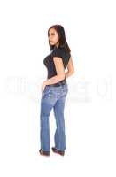 Tall woman standing in jeans from the back