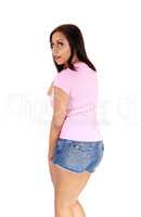 Woman standing from back in jeans shorts
