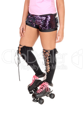 Close up of the legs of a  roller-skating woman