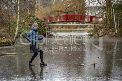 Woman on frozen pond in winter