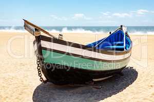 Fishing boat on the beach of Nazare in Portugal