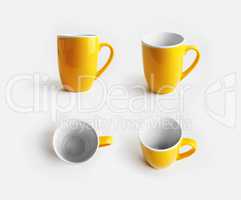 Yellow ceramic mugs