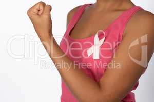 Woman shows pink ribbon for breast cancer awareness