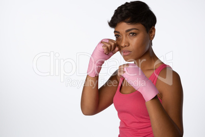 Serious looking woman fighting against breast cancer