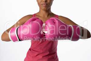 Woman for breast cancer awareness with ribbon in boxing gloves