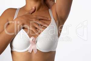 Woman for breast cancer awareness with ribbon