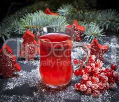 tea from a viburnum in a transparent glass with a handle