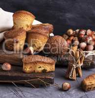 baked cupcakes with dried fruits on a wooden board