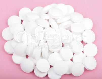 white pill on pink background