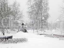 city park after snowfall at day