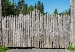 Wooden gates made of sharpened logs