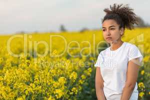 Sad Mixed Race African American Teenager Woman in Yellow Flowers