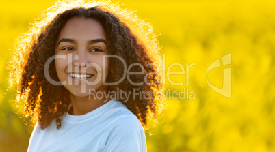 Happy Mixed Race African American Teenager Woman in Yellow Flowe