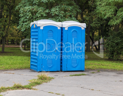 Two blue booths of the biotoilete