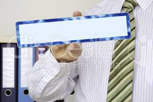 Businessman holding blank sign