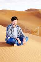 Man alone in the desert on the sand dune