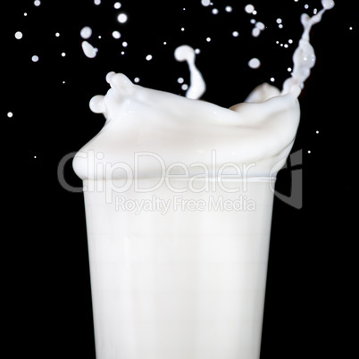 Glass with splashing milk