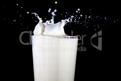 Glass with splashing milk