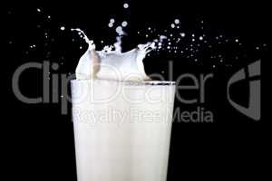 Glass with splashing milk