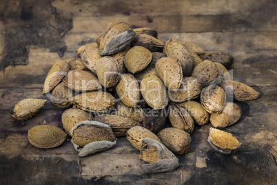 Almonds on an old wood background