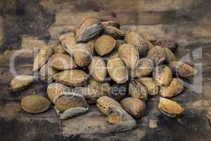 Almonds on an old wood background