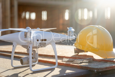 Drone Quadcopter Next to Hard Hat Helmet At Construction Site